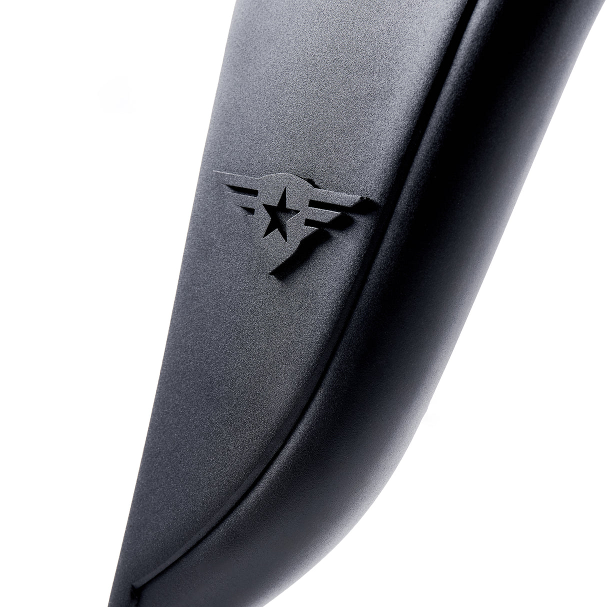 Close-up view of a black aluminum fender flare, highlighting the removable, paintable Combat Off Road logo near the edge. The surface features a textured powder-coated finish for added durability and a sleek, rugged appearance. Designed for Jeep Wranglers, this detail showcases the precision and quality of the flare.