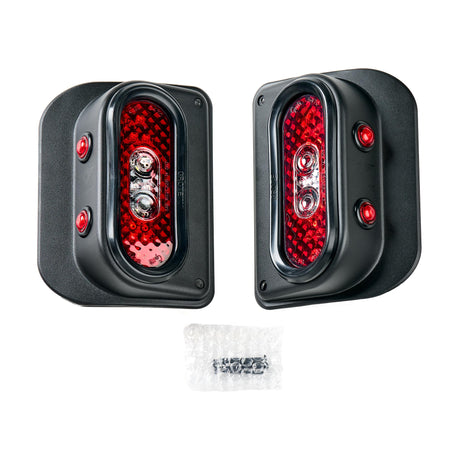 Pair of Tail Gunner Tail Lights designed for the Jeep JK. These oval-shaped lights feature a robust black aluminum housing with bright red LED main lights and two additional red side markers. The set includes both left and right tail light assemblies along with mounting hardware, providing a complete and durable lighting solution for off-road or everyday use.