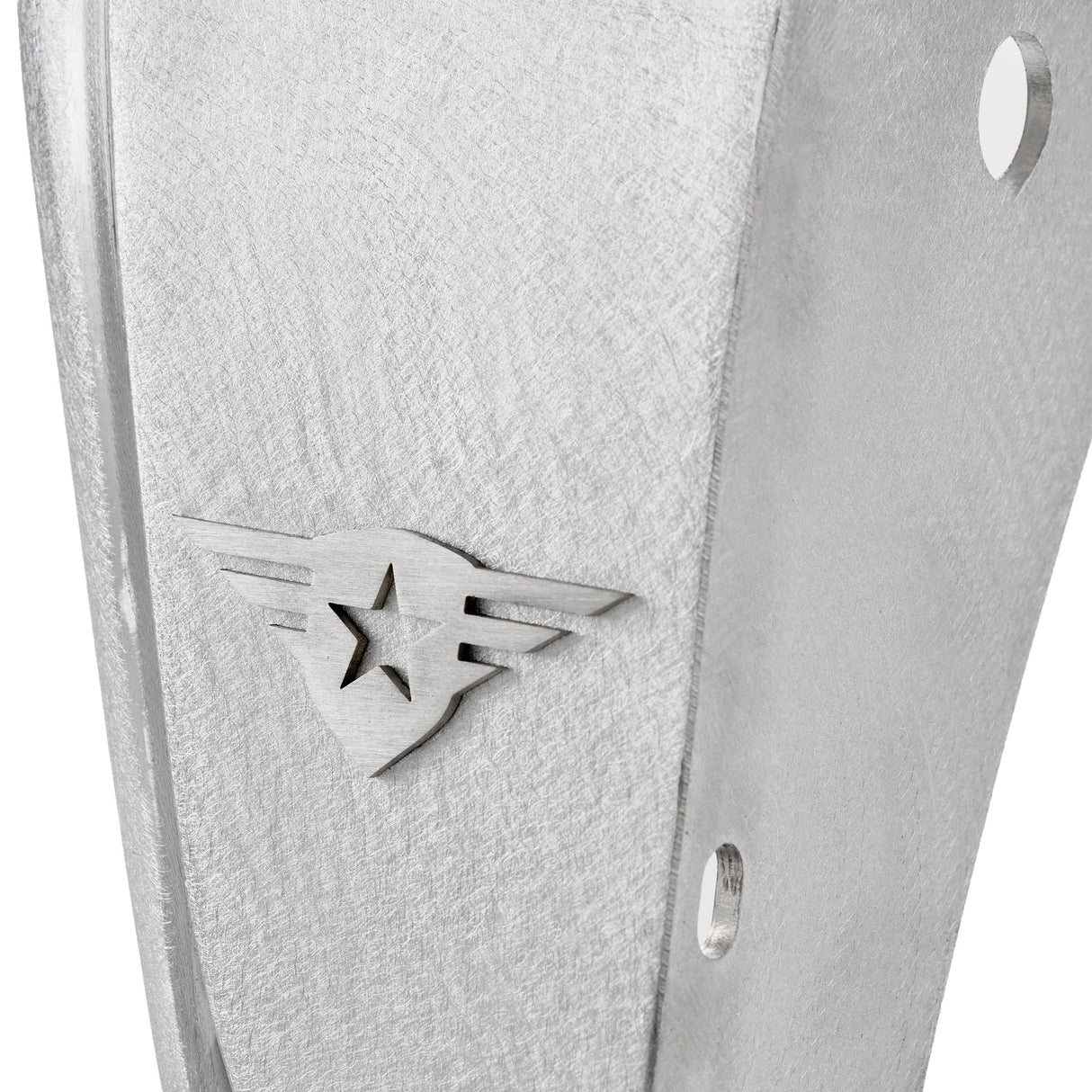 Close-up view of a raw aluminum rear fender flare for a Jeep Wrangler, showcasing the natural metal finish and the removable, paintable Combat Off Road logo near the edge. The image also highlights pre-drilled holes for easy installation, emphasizing durability and customization for off-road use.