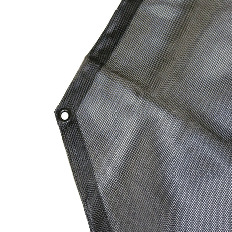 Close up of the edge of a black mesh Jeep sunshade showing the reinforced edge and metal mounting grommet