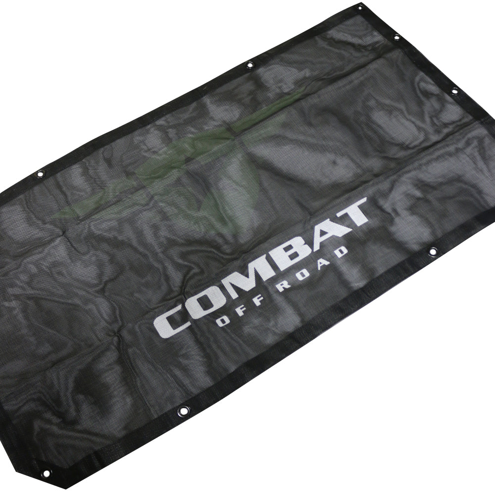 Combat Off Road sunshade designed for the 2-door Jeep JL. The sunshade is constructed from durable black mesh material, providing shade while maintaining airflow inside the vehicle. Features the Combat Off Road logo printed in white for branding and multiple grommets for secure attachment to the Jeep's frame. Ideal for off-road adventures and sunny weather.