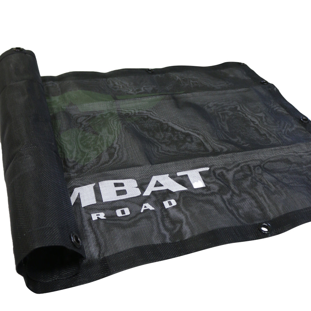 Combat Off Road sunshade designed for the 2-door Jeep JL. The sunshade is constructed from durable black mesh material, providing shade while maintaining airflow inside the vehicle. Features the Combat Off Road logo printed in white for branding and multiple grommets for secure attachment to the Jeep's frame. Ideal for off-road adventures and sunny weather.