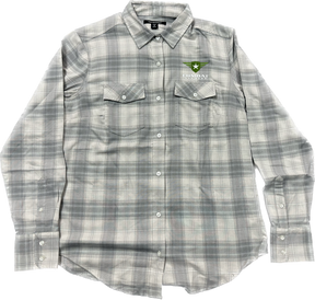 A light gray plaid button-up shirt featuring the Combat Off Road logo embroidered on the upper left chest. The logo includes a green shield with a white star and winged accents, accompanied by the text "Combat Off Road" in white. The shirt has two chest pockets with button closures, long sleeves, and a collar, offering a clean and versatile style.