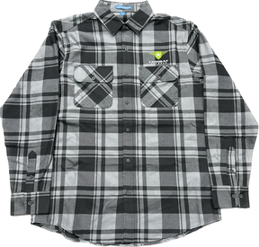 A black and gray plaid shirt featuring the Combat Off Road logo embroidered on the upper left chest. The logo includes a green shield with a white star and winged accents, accompanied by the text "Combat Off Road" in white. The shirt has a button-up design with two front chest pockets and long sleeves, offering a rugged yet comfortable style