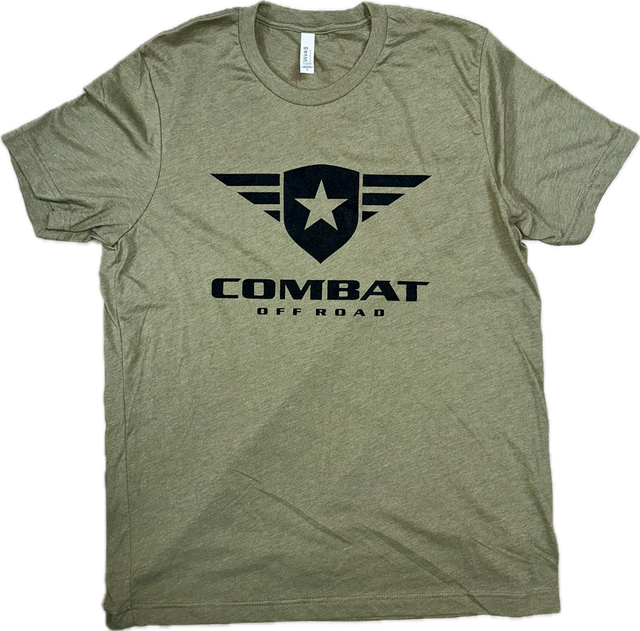 A olive t-shirt featuring the Combat Off Road logo printed in black on the chest. The logo includes a shield with a star and winged accents, accompanied by the text "Combat Off Road" in bold black letters underneath. The shirt has a crewneck design and short sleeves, offering a classic and comfortable fit.